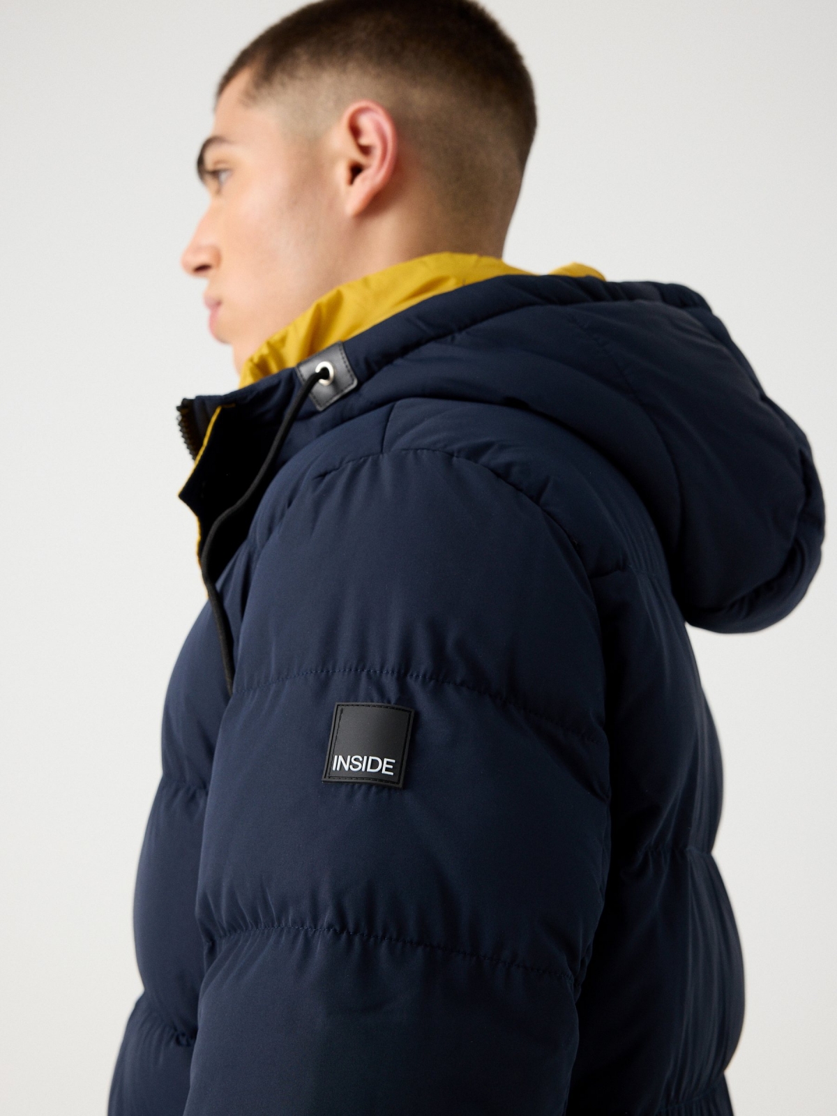 Contrast padded jacket navy detail view