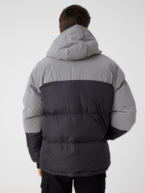 Two-tone padded jacket with hood black middle back view
