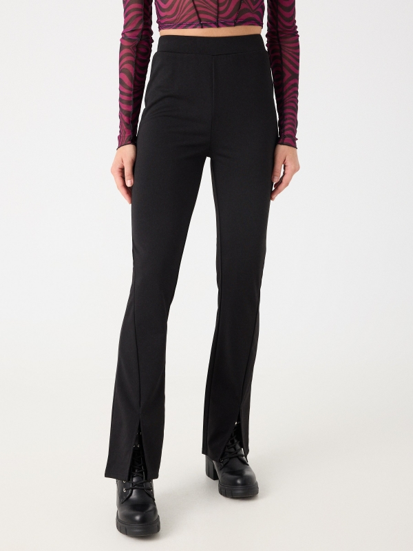 Flared leggings with a slit black middle front view