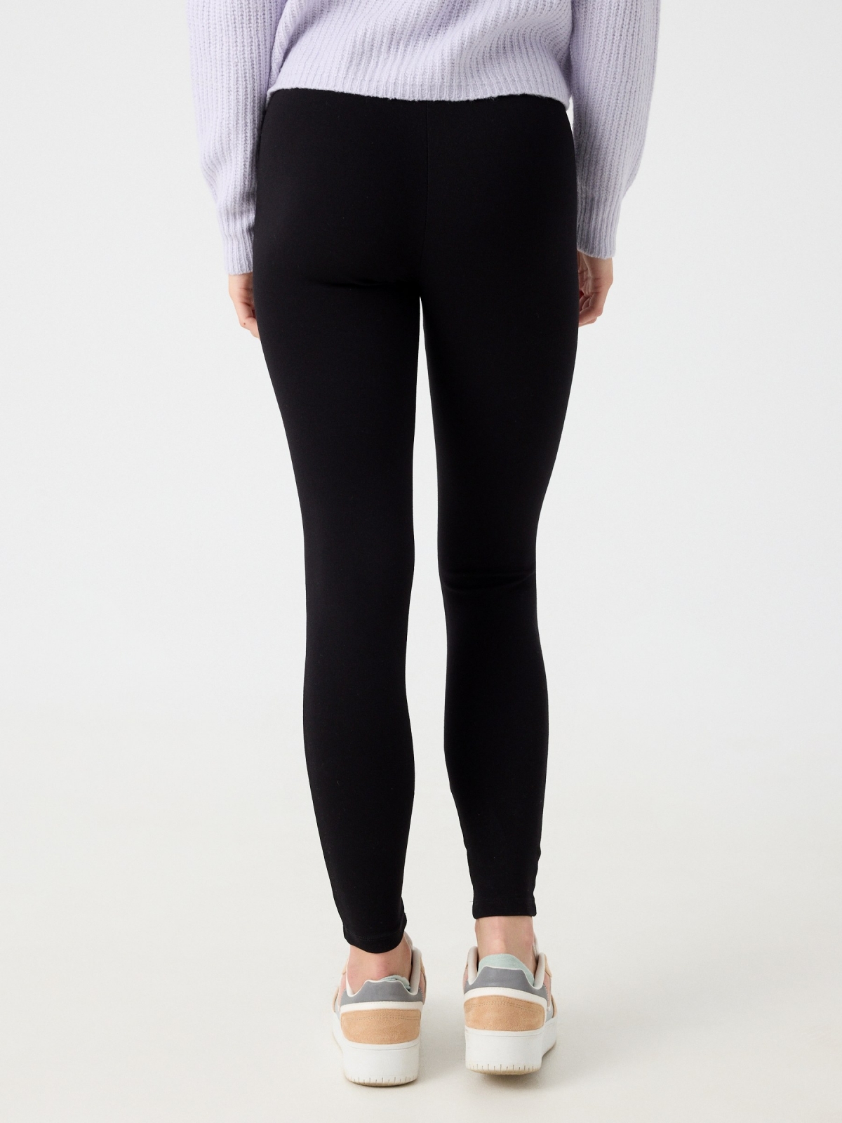 High-waisted zip-up leggings black middle back view