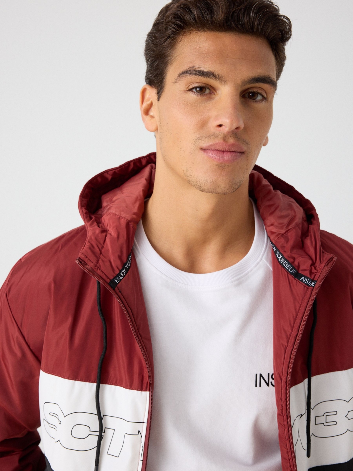 Quilted color block jacket with text red detail view