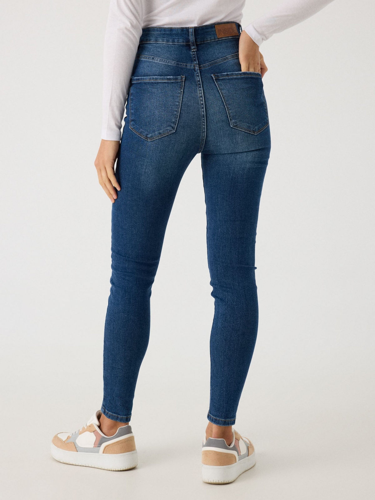 Blue high waisted five pocket skinny jeans blue middle back view