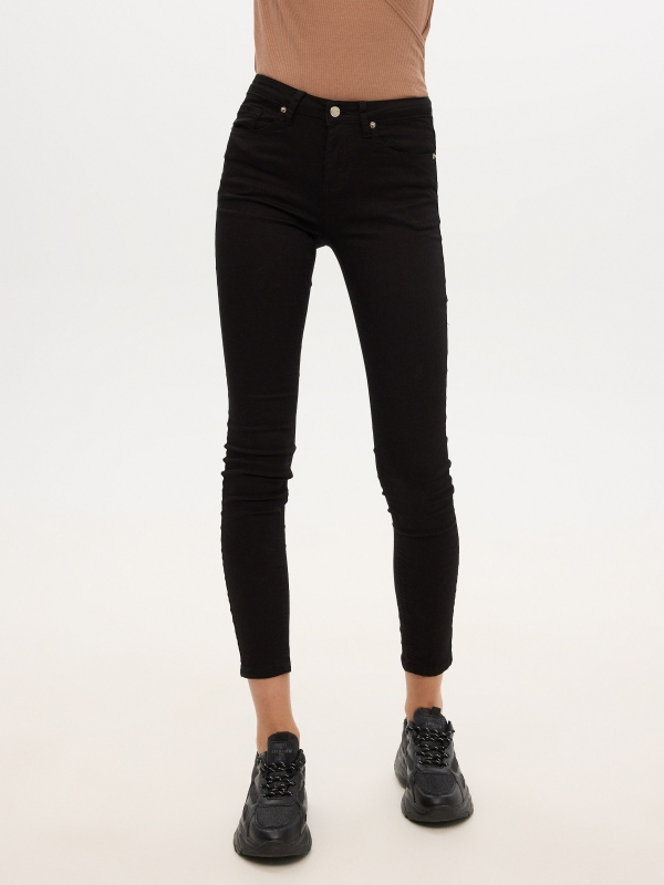 Mid rise skinny jeans black middle front view