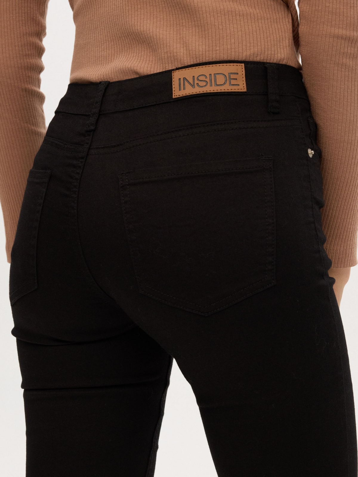 Mid rise skinny jeans black detail view