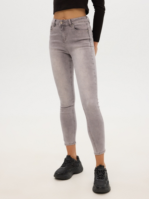 Worn push up skinny jeans light grey middle front view