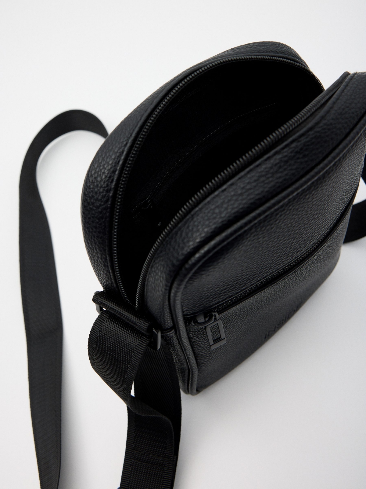 Black eco-leather crossbody bag detail view