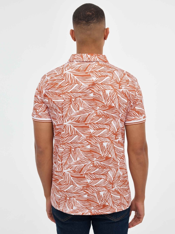 Slim fit tropical print polo shirt brick red middle back view