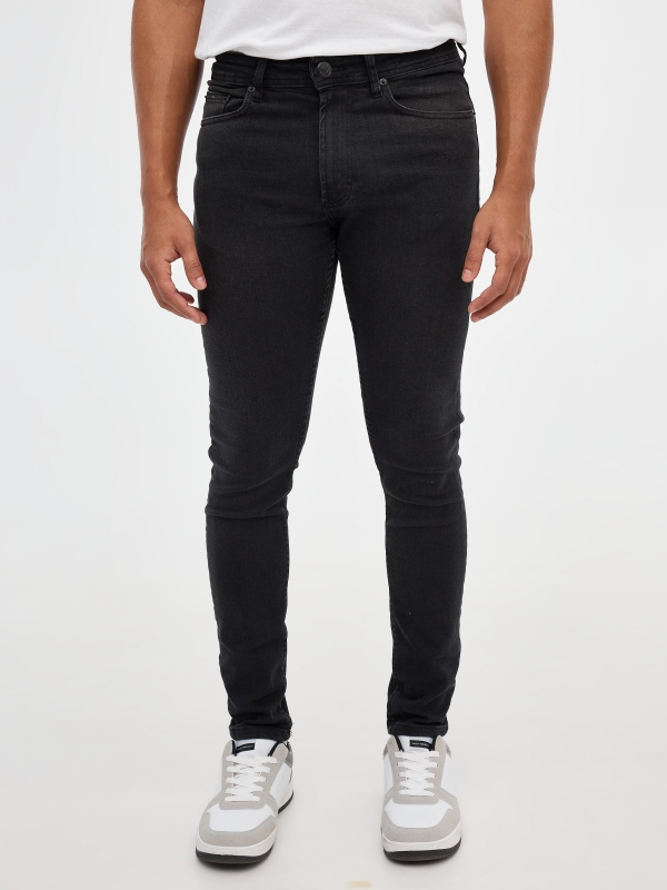 Black skinny jeans black middle front view