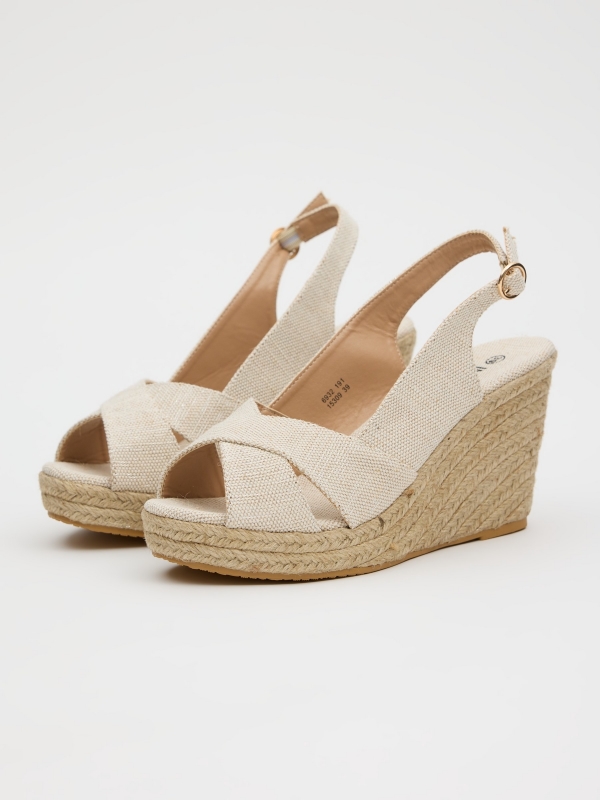 Jute wedge with crossed straps sand 45º front view