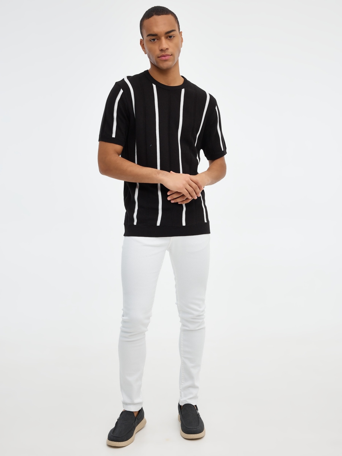 Striped knitted polo shirt black front view