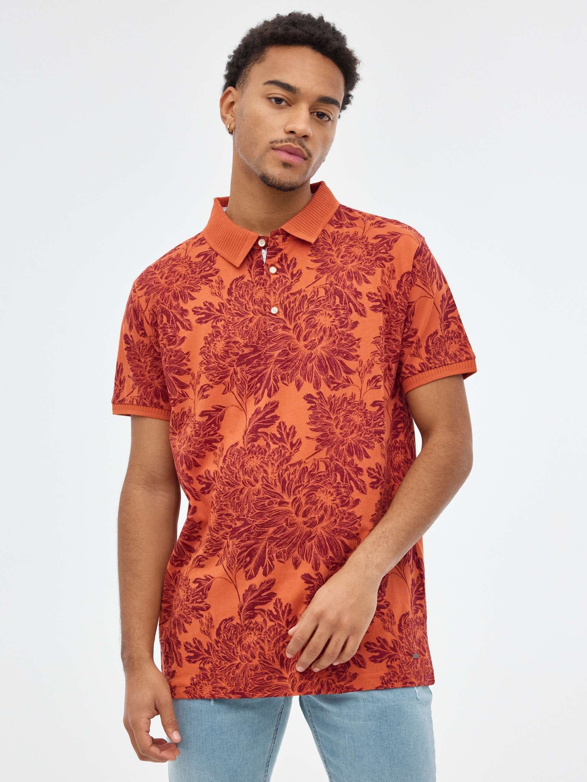 Floral print polo shirt brick red middle front view