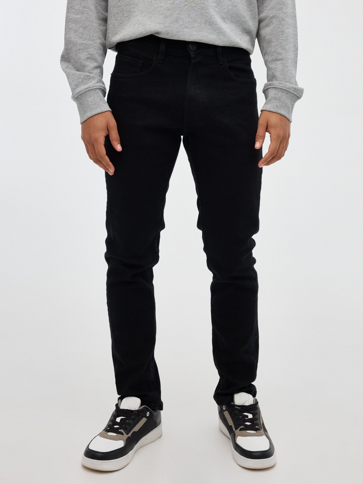 Black slim jeans black middle front view