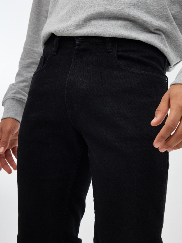 Black slim jeans black detail view