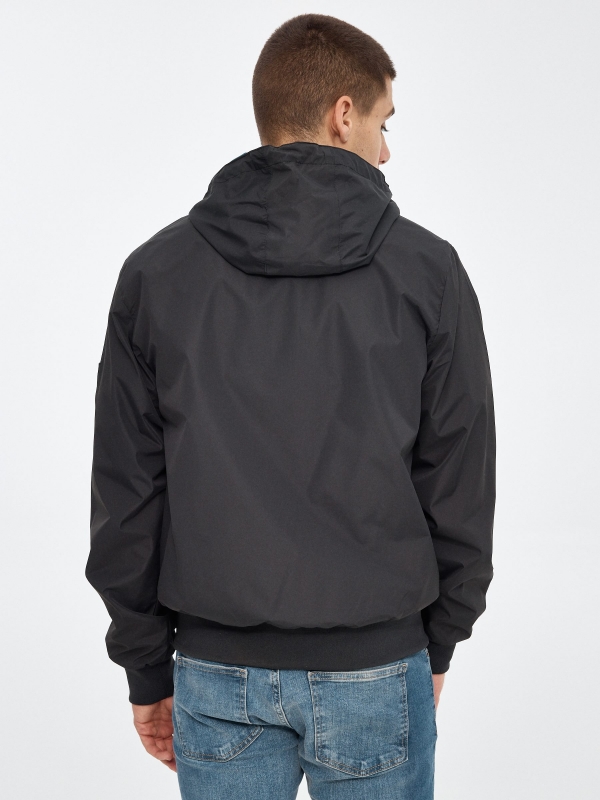 Lightweight hooded jacket black middle back view