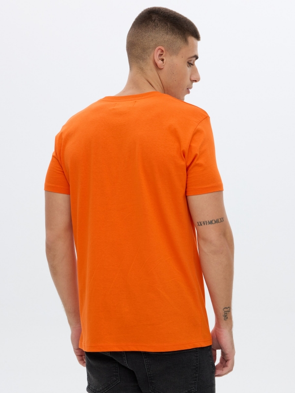 Camiseta Create Yourself naranja vista media trasera