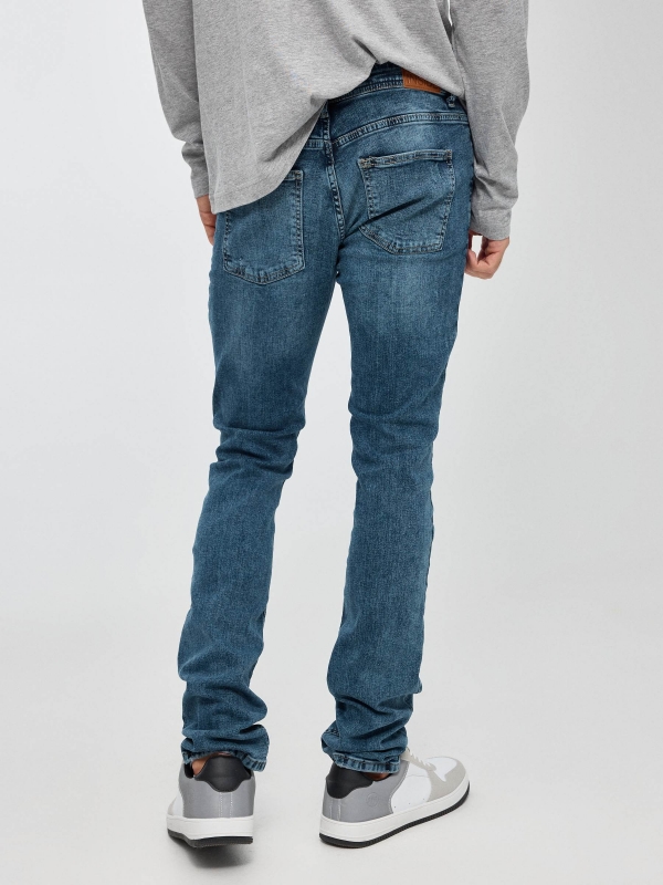 Slim jeans dark blue middle back view