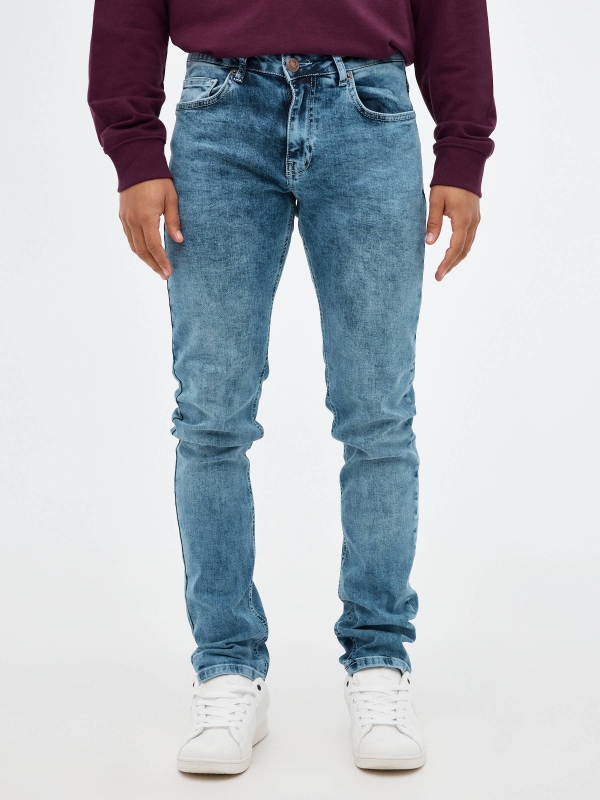 Worn out blue slim jeans blue middle front view