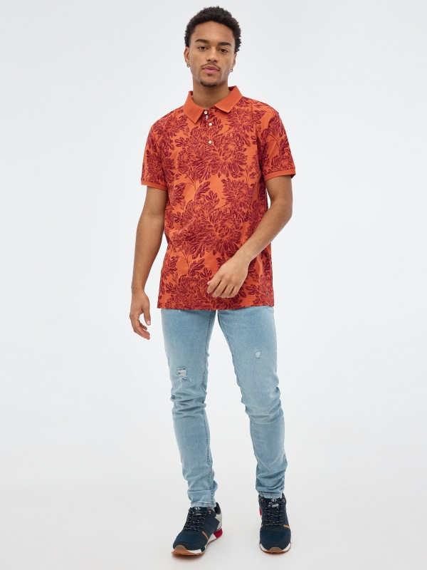 Floral print polo shirt brick red front view