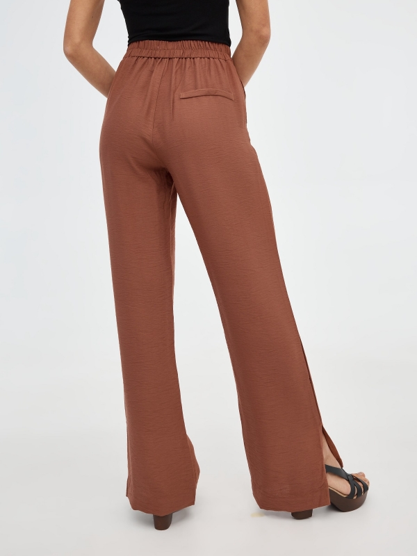 Straight pants with slits brown front view