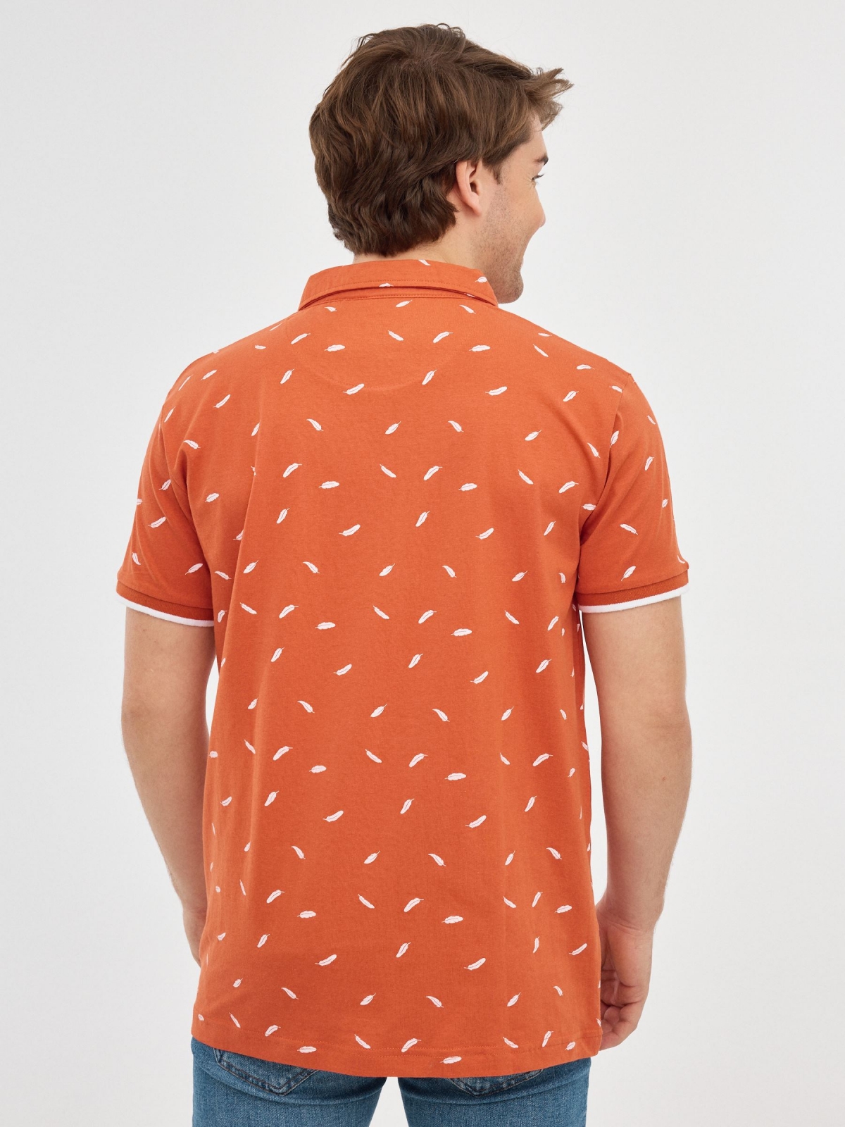 Feather print polo shirt brick red middle back view