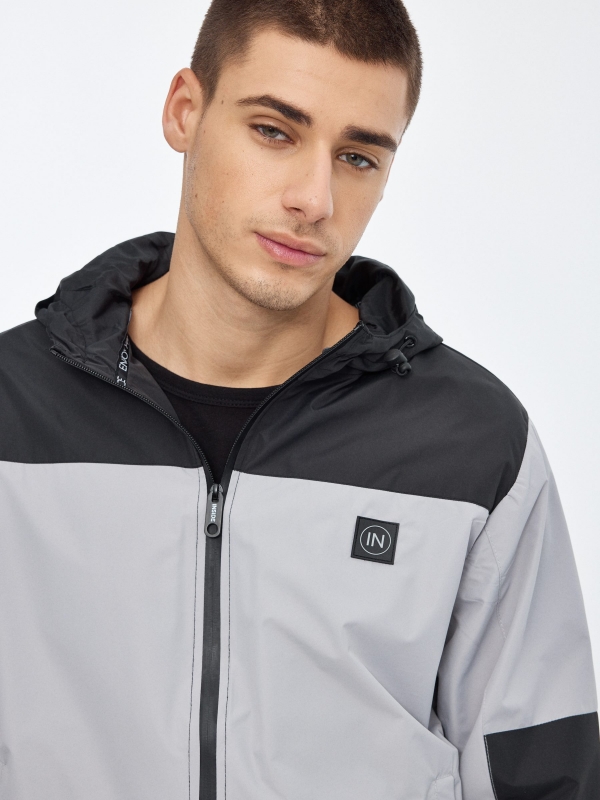 Lightweight hooded jacket grey detail view