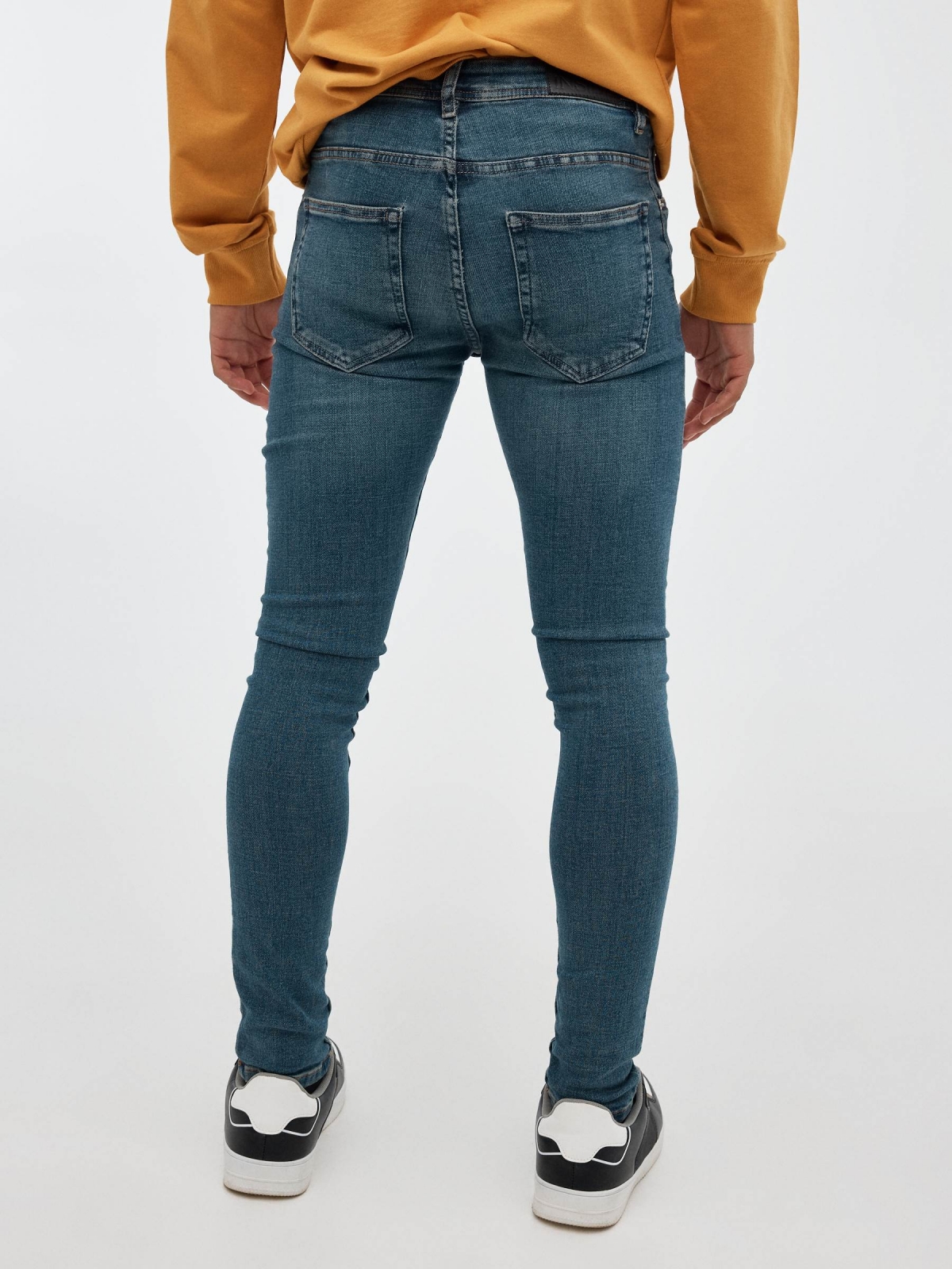 Blue skinny jeans low rise blue middle back view