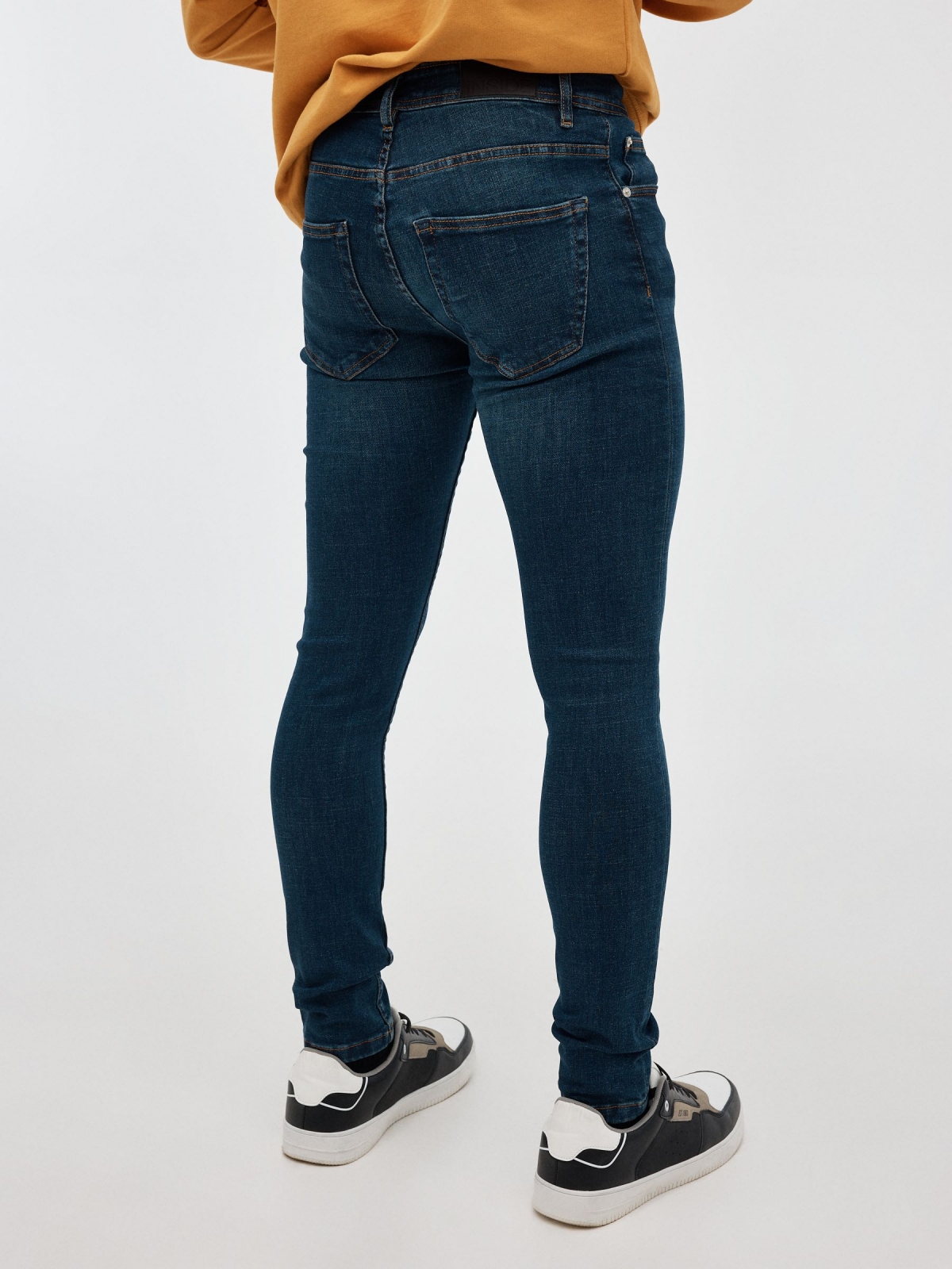 Dark blue skinny jeans blue middle back view