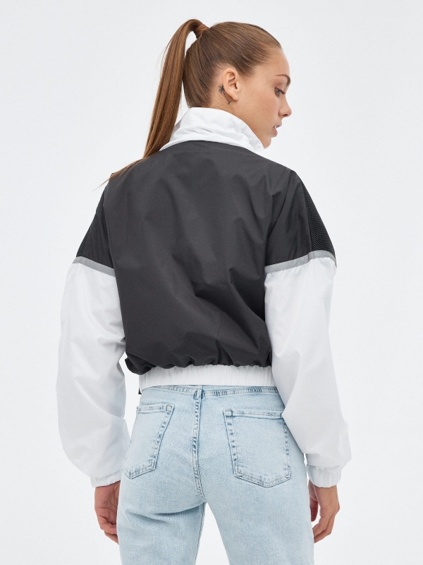 Lightweight nylon jacket black middle back view