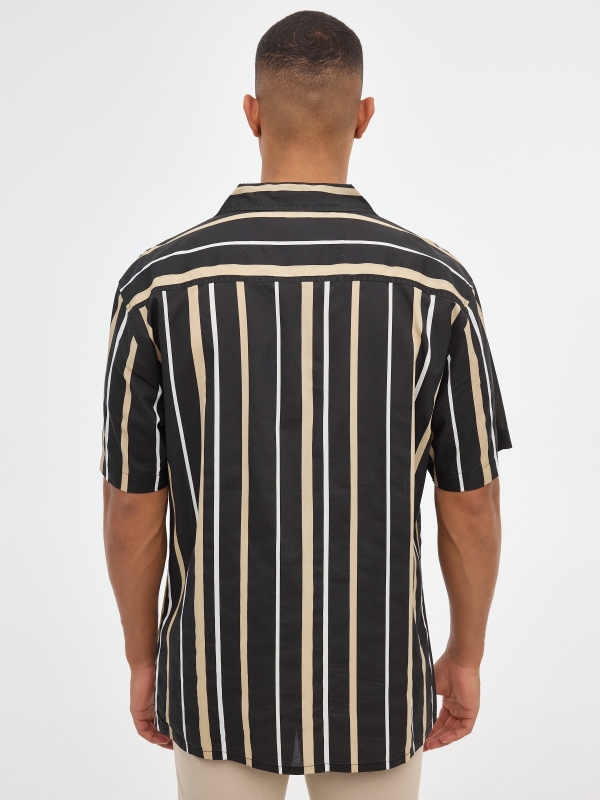 Man striped shirt black middle back view