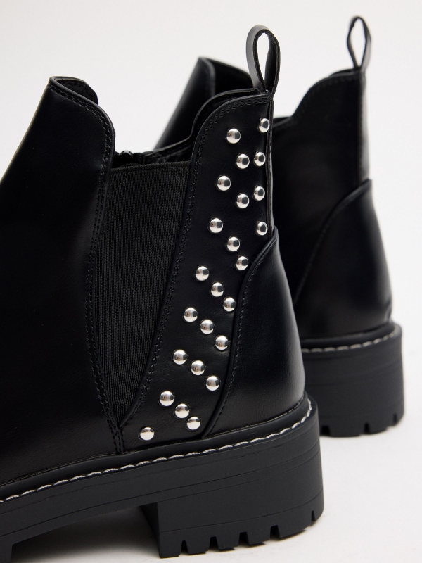 Studded elastic ankle boots detail view