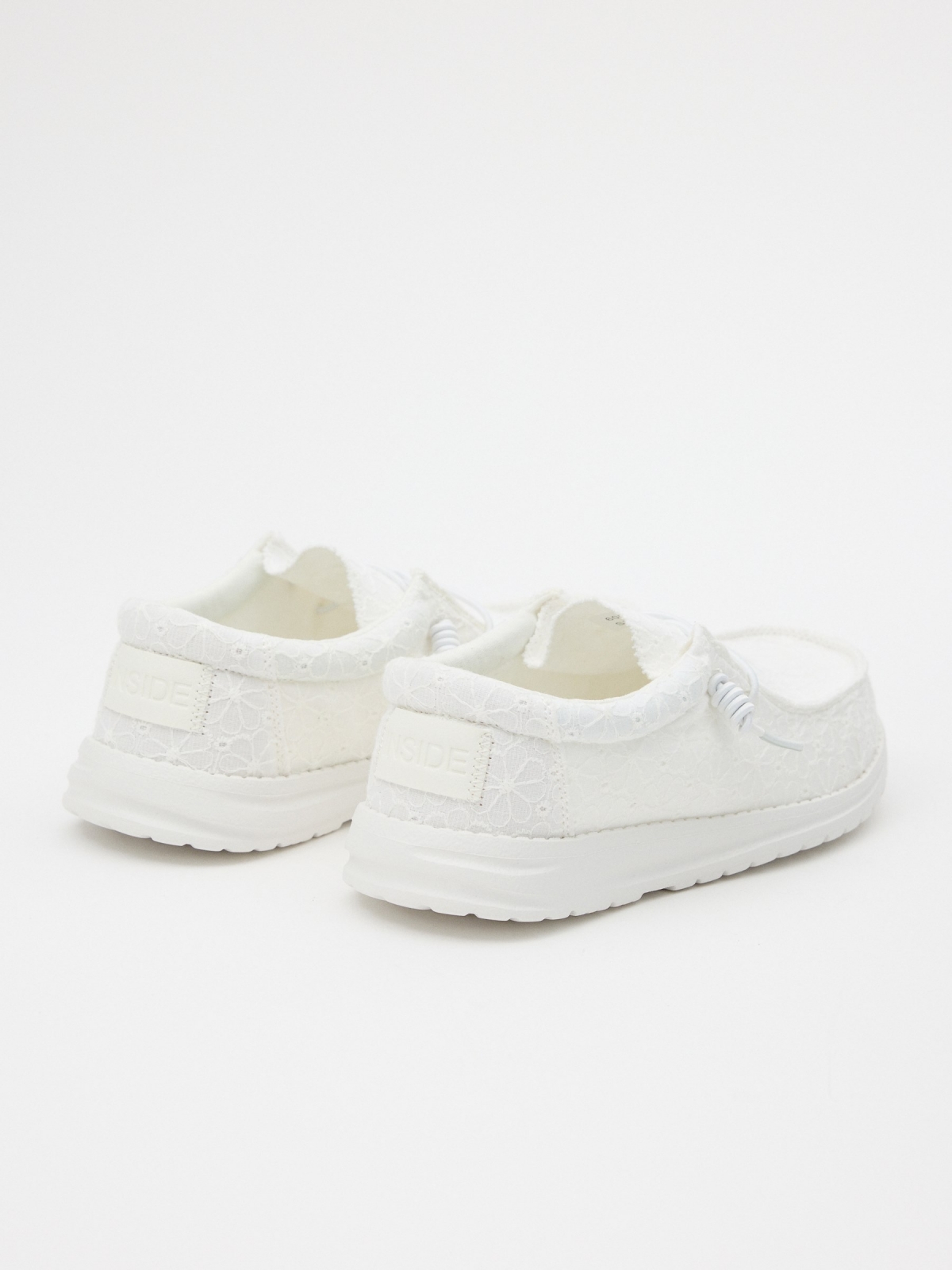Casual elastic sneakers sand 45º back view