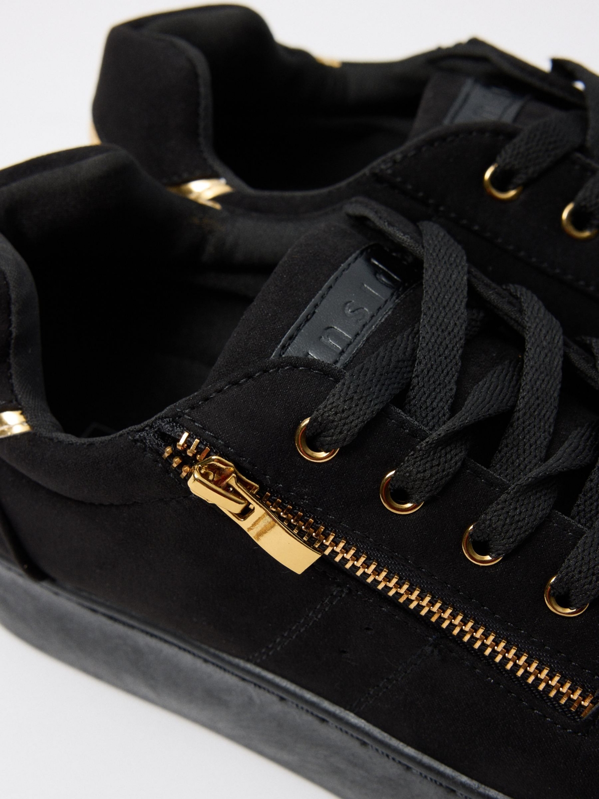 Black sneaker with platform black detail view