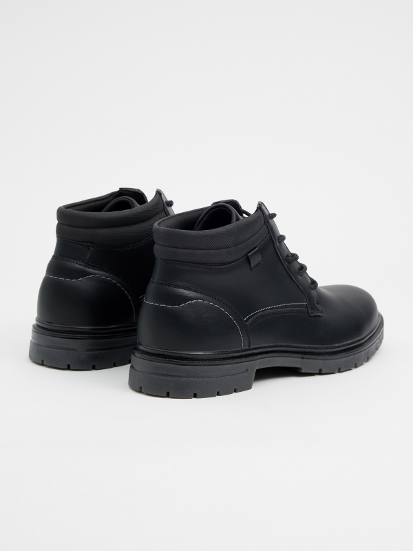 Black leather effect boots with stitching black 45º back view