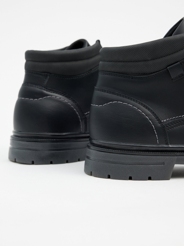 Black leather effect boots with stitching black detail view