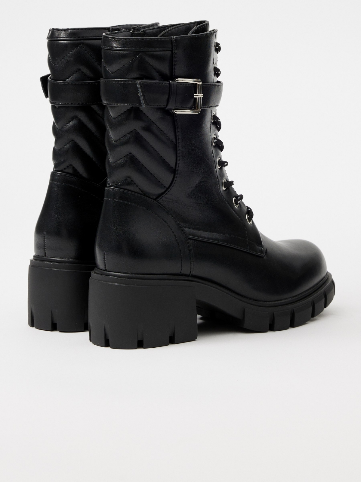 Buckle track sole ankle boot black 45º back view