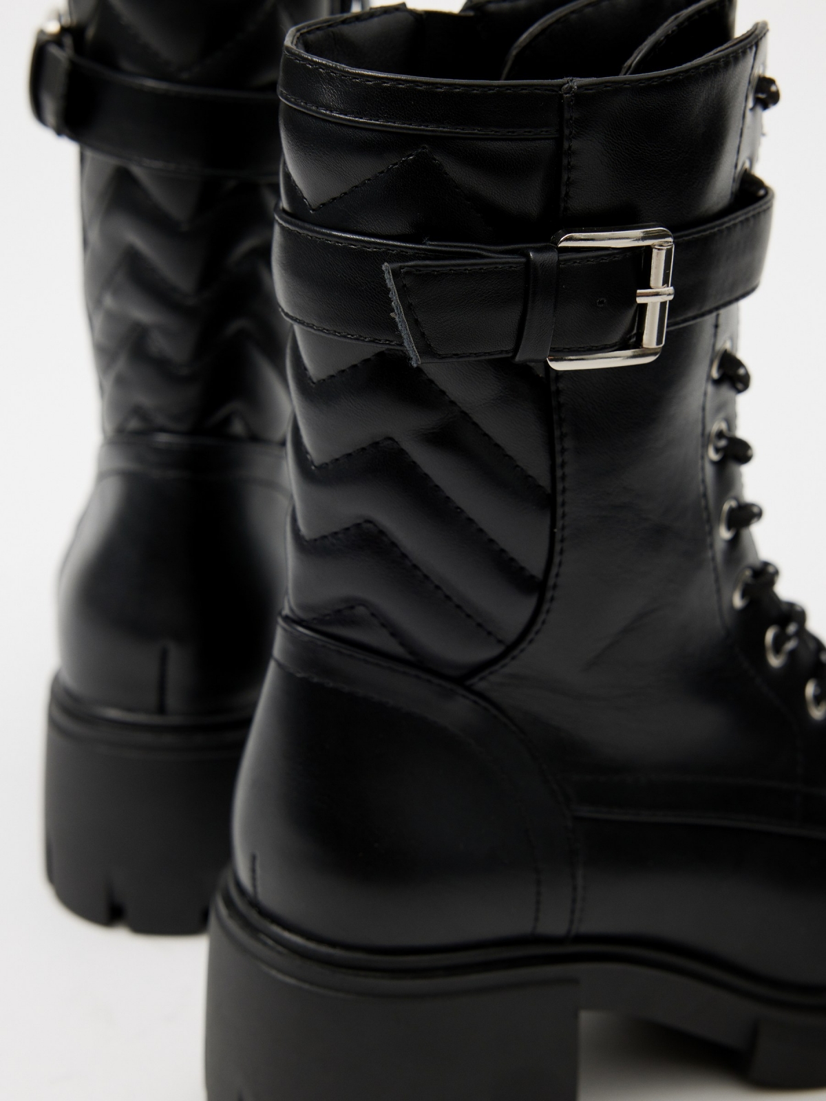 Buckle track sole ankle boot black detail view