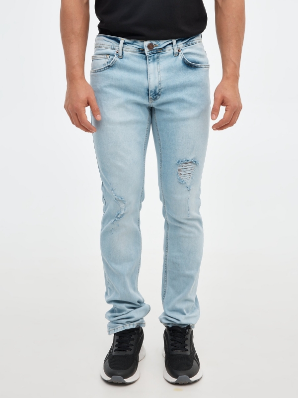 Ripped regular denim jeans blue middle back view