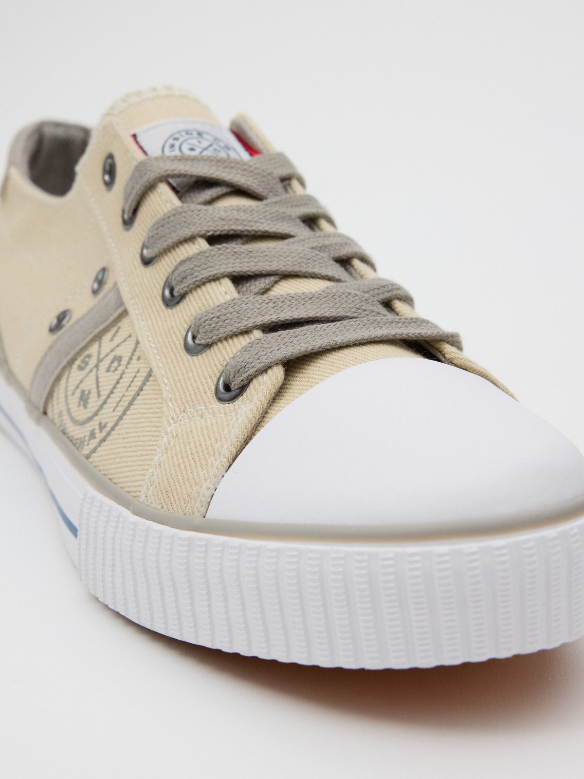 Casual printed canvas sneaker sand detail view