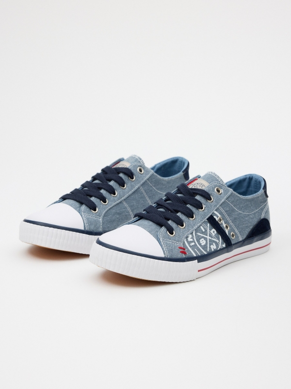 Casual canvas sneaker with toe cap steel blue 45º front view