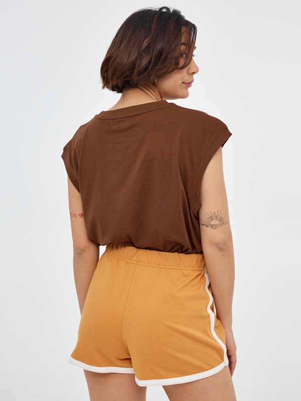 Embroidered knitted shorts ochre middle back view