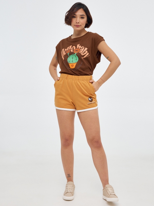 Embroidered knitted shorts ochre front view