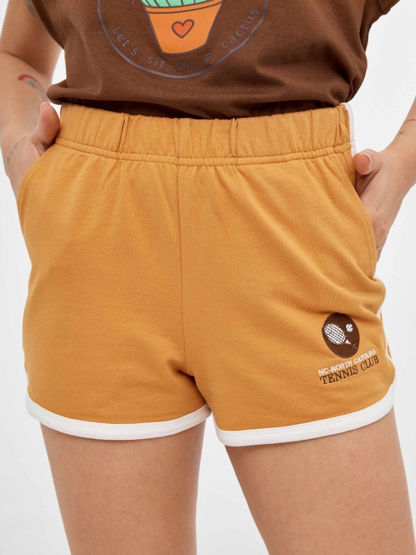 Embroidered knitted shorts ochre foreground