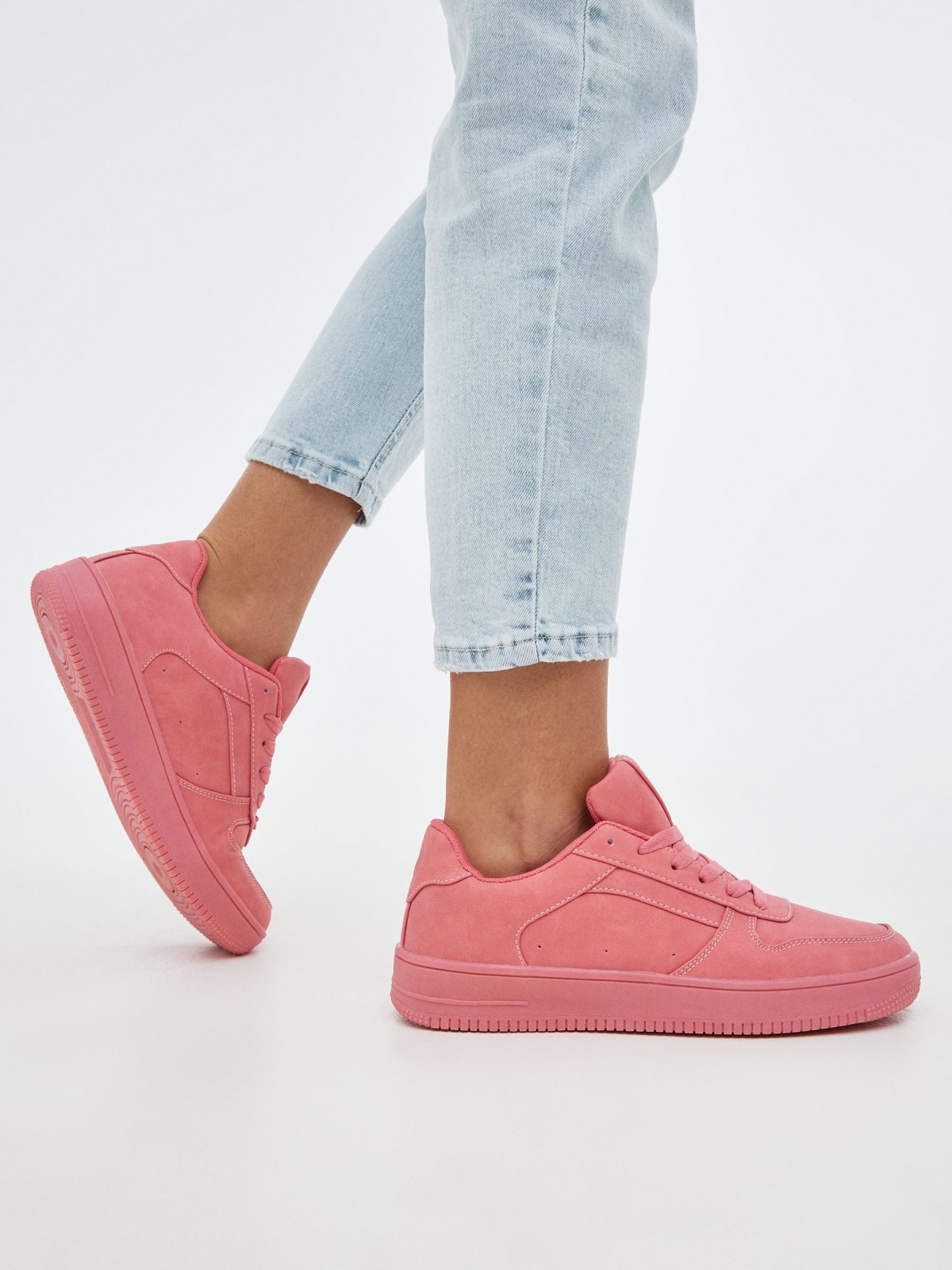 Pink casual sneaker coral with a model