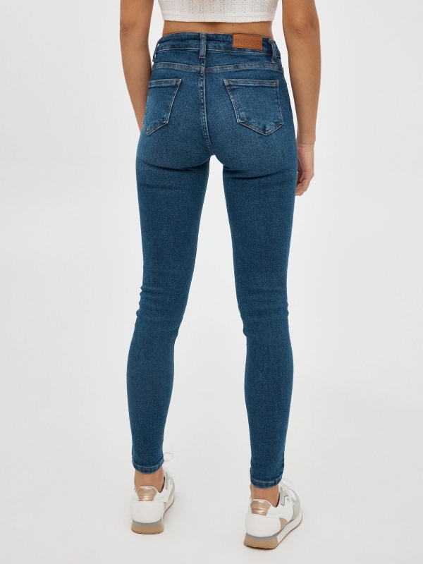Mid rise skinny jeans blue middle back view