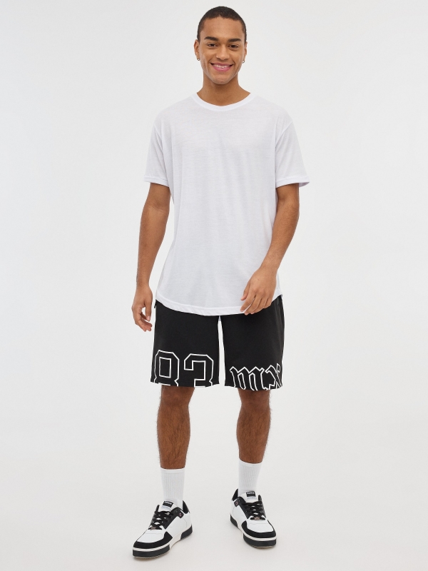 Printed Bermuda jogger shorts black front view