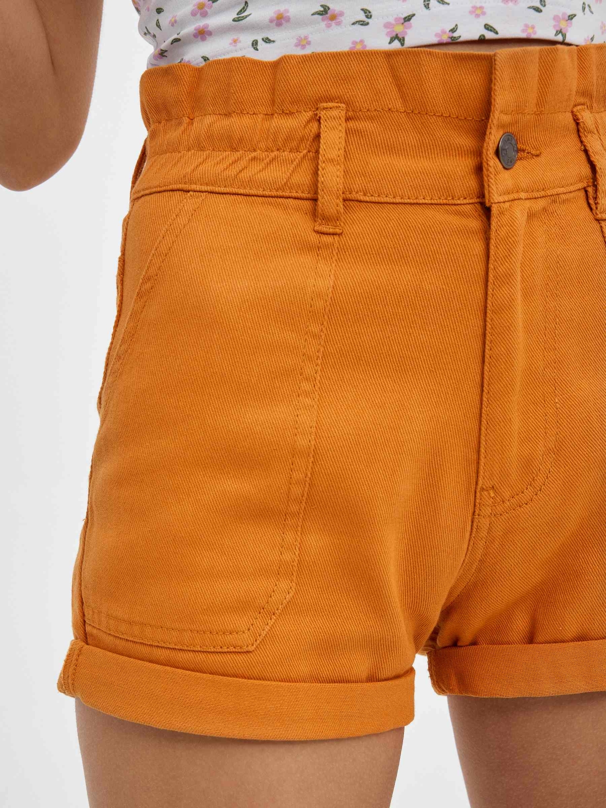 Coloured baggy  shorts ochre detail view