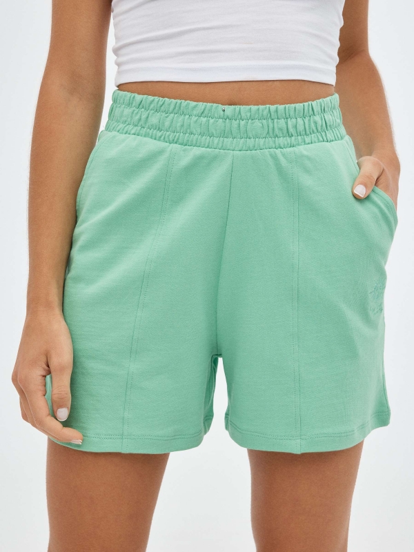 Plush green shorts mint detail view