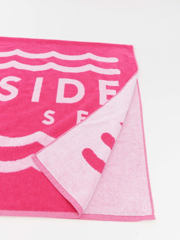 Inside beach towel fuchsia foreground with a model