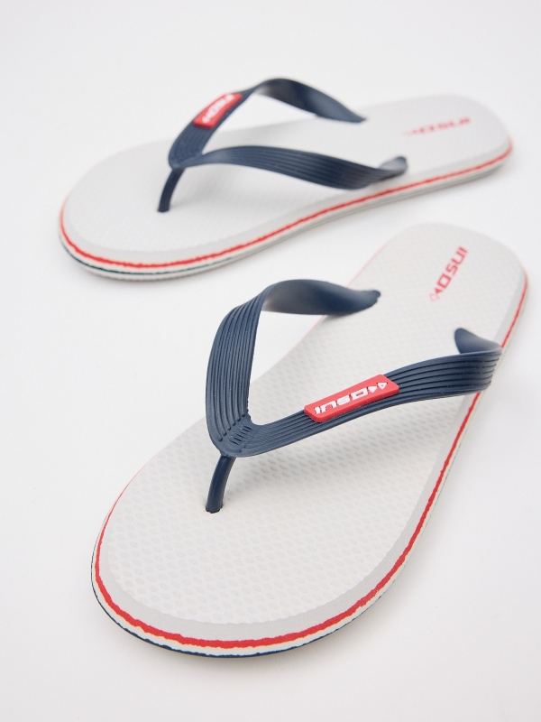 White toe flip flop with engraved strips white detail view