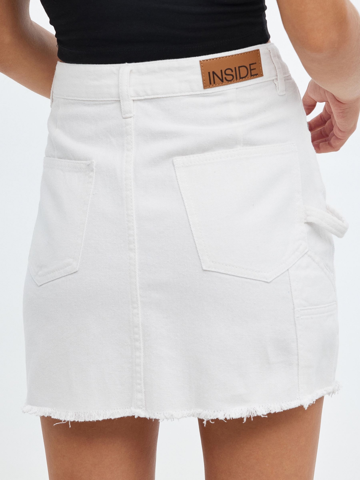 Denim skirt with pleated hem white detail view